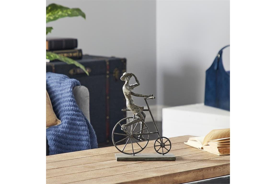 Lady Riding Bike Sculpture